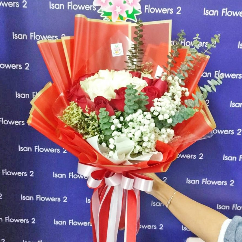 12 red and 12 white big roses in red round bouquet a