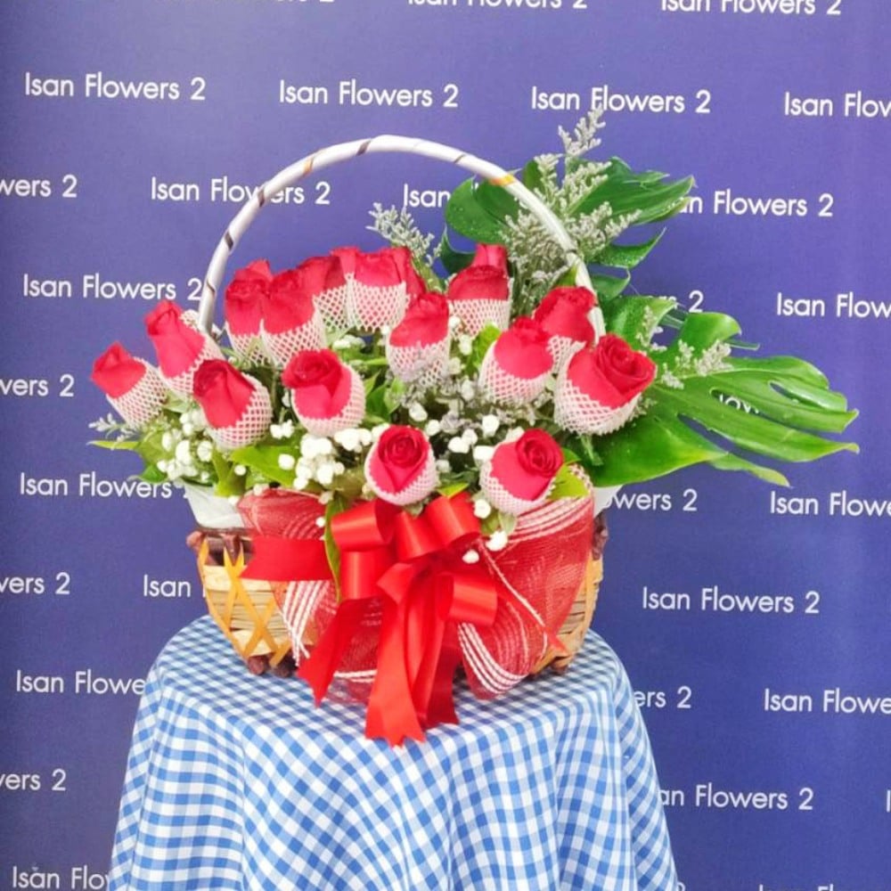 21 big red roses with filler short in basket c