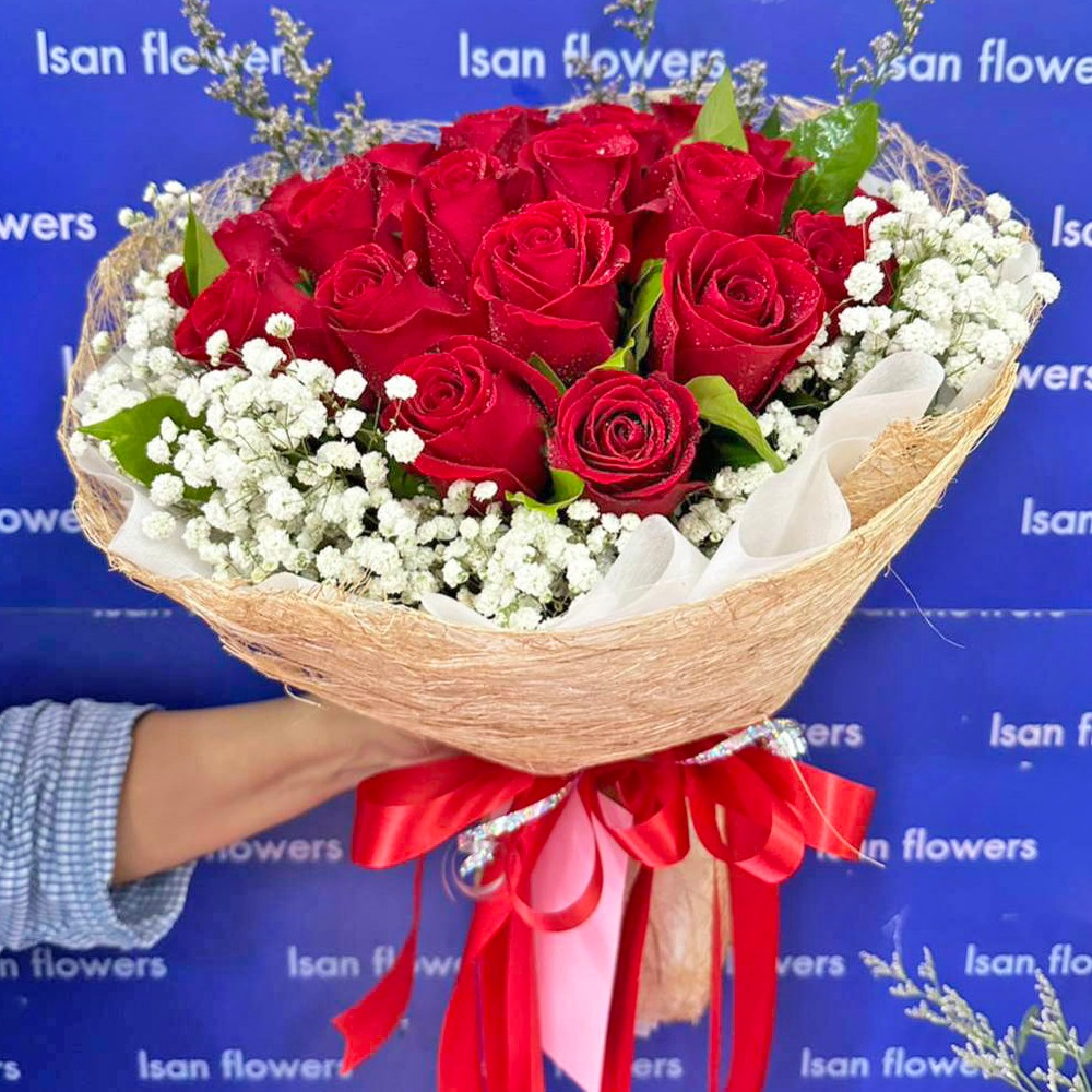 24 big red roses in brown round bouquet a