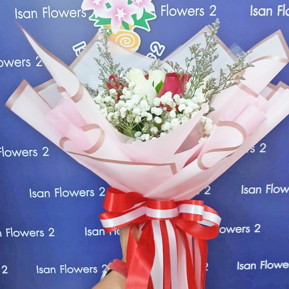 6 red and 6 white big roses in pink round bouquet a pre