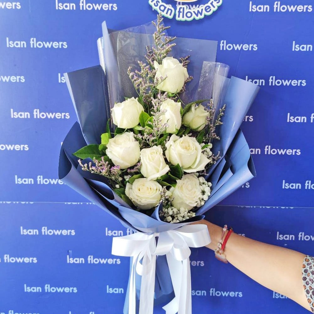 9 big white roses in dark blue tall bouquet a