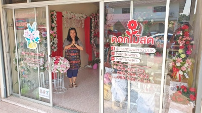 Rin standing inside Isan Flowers 2 Shop